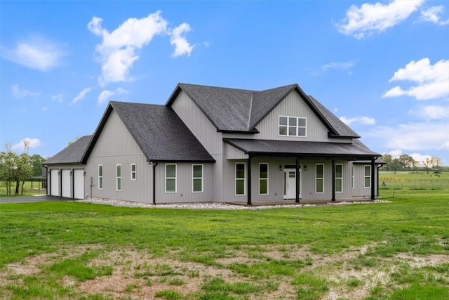 17153 Mill Hill Rd, Garfield, AR 72732 - rear view of property with a shingled roof, a garage, a porch, a lawn, and driveway