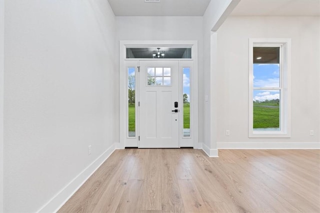 17153 Mill Hill Rd, Garfield, AR 72732 - entryway with baseboards and light wood-style flooring
