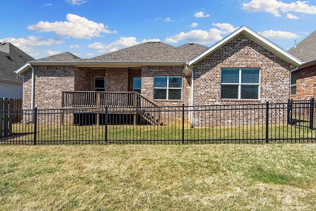 view of front of house featuring fence and brick siding