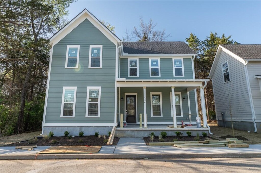 traditional-style house featuring a porch