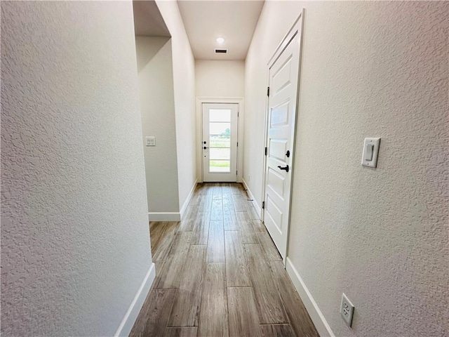 6405 NW Harley St, Bentonville, AR 72713 - hall featuring a textured wall and wood finished floors