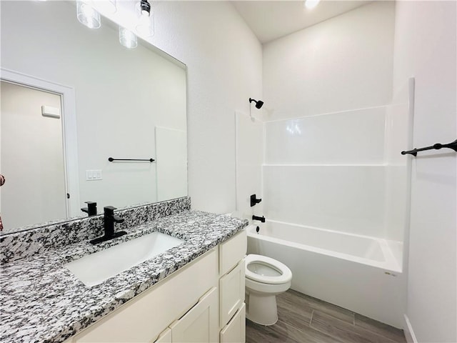 6405 NW Harley St, Bentonville, AR 72713 - bathroom featuring vanity, wood finished floors, and washtub / shower combination