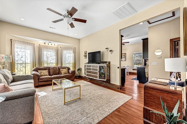10093 Oklahoma Dr, Rogers, AR 72758 - living room with a ceiling fan, visible vents, and plenty of natural light