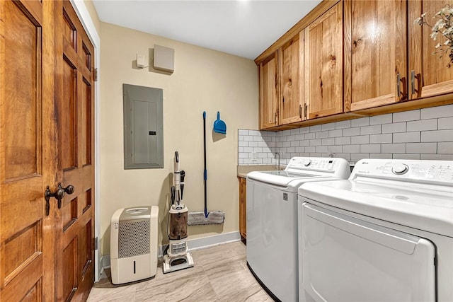 10093 Oklahoma Dr, Rogers, AR 72758 - laundry area with washer and dryer, electric panel, baseboards, and cabinet space