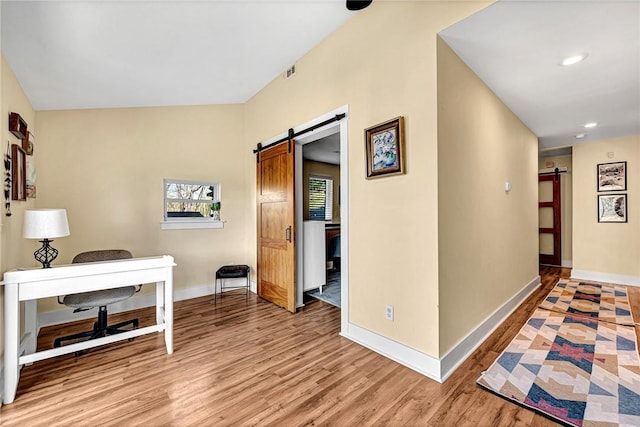 10093 Oklahoma Dr, Rogers, AR 72758 - corridor with a barn door, baseboards, and light wood finished floors
