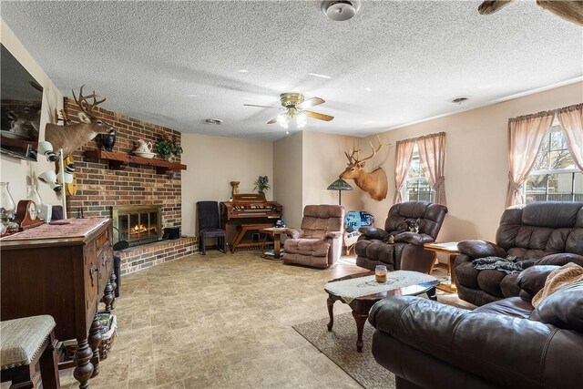 304 Angela St, Springdale, AR 72762 - living room featuring plenty of natural light, a brick fireplace, a textured ceiling, and a ceiling fan