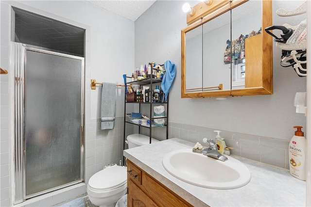 304 Angela St, Springdale, AR 72762 - full bath featuring a shower stall, a textured ceiling, vanity, and toilet