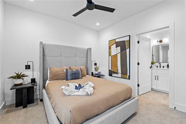 carpeted bedroom with ceiling fan, ensuite bath, and recessed lighting
