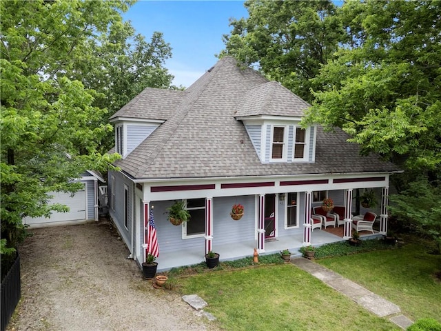 42 Vaughn St, Eureka Springs, AR 72632 - view of front of house with roof with shingles, a porch, a front lawn, dirt driveway, and an outdoor structure