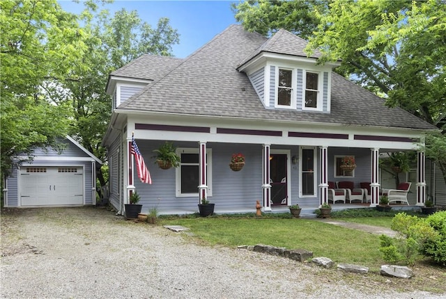 42 Vaughn St, Eureka Springs, AR 72632 - view of front of property featuring an outbuilding, a porch, a shingled roof, driveway, and a detached garage