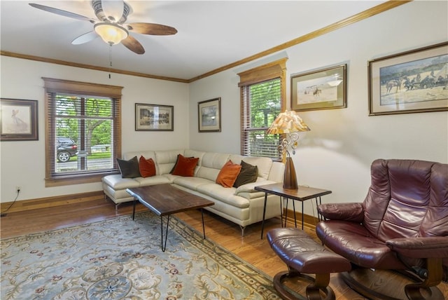 42 Vaughn St, Eureka Springs, AR 72632 - living area featuring wood finished floors, healthy amount of natural light, crown molding, and ceiling fan