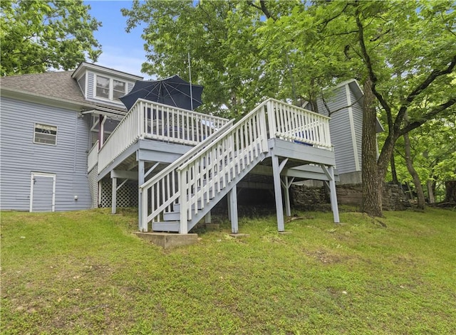 42 Vaughn St, Eureka Springs, AR 72632 - back of property with a yard, a wooden deck, stairs, and a shingled roof