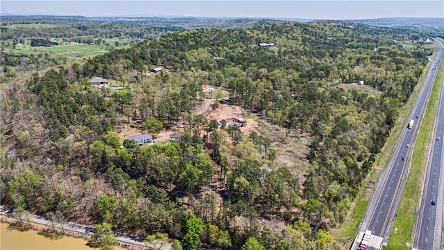drone / aerial view featuring a view of trees