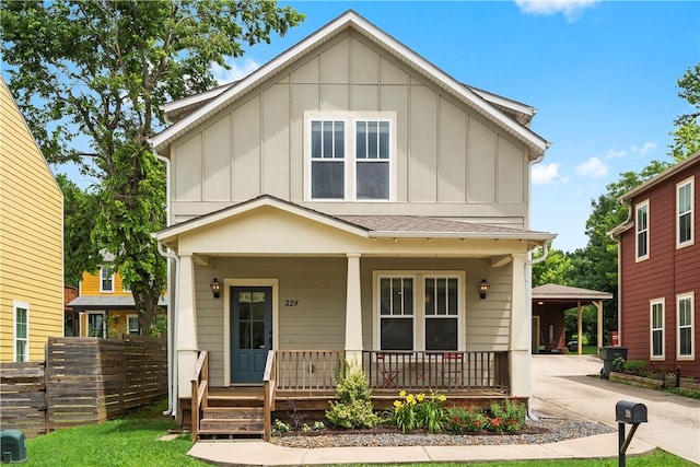 328 Martin Luther King Jr Blvd, Fayetteville, AR 72701 - view of front facade with board and batten siding, a porch, and driveway