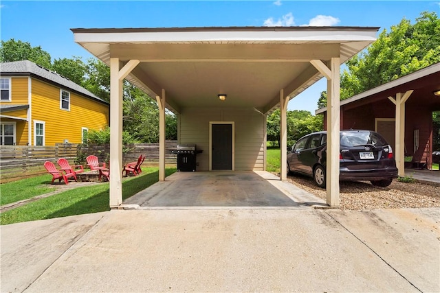 328 Martin Luther King Jr Blvd, Fayetteville, AR 72701 - view of car parking featuring a fire pit and concrete driveway