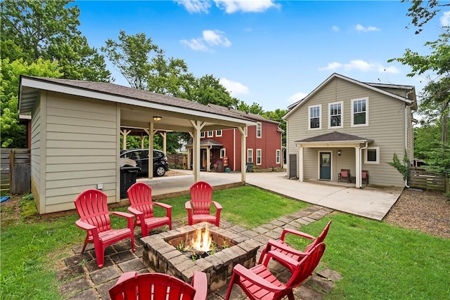 328 Martin Luther King Jr Blvd, Fayetteville, AR 72701 - back of property with a fire pit, a carport, and a patio area
