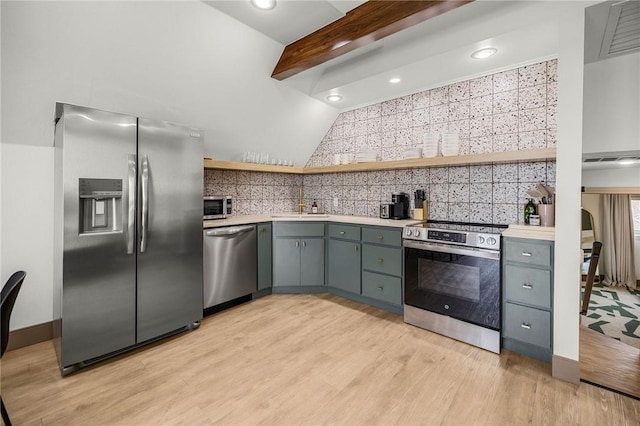 kitchen with light wood-style flooring, open shelves, appliances with stainless steel finishes, light countertops, and backsplash