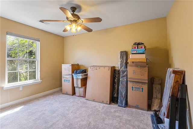interior space featuring ceiling fan and visible vents