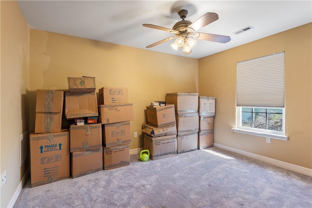 storage area with visible vents and ceiling fan