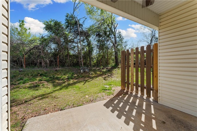 view of patio with a gate