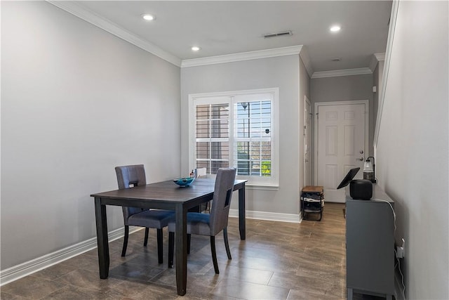 dining room featuring baseboards, ornamental molding, visible vents, and recessed lighting