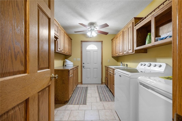 9961 Rainbow Ridge Rd, Omaha, AR 72662 - washroom with washing machine and clothes dryer, light tile patterned flooring, cabinet space, ceiling fan, and a sink