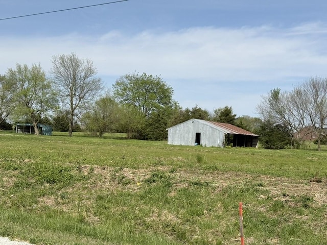 11161 S Old Cincinnati Rd, Lincoln, AR 72744 - view of yard with a pole building and an outdoor structure