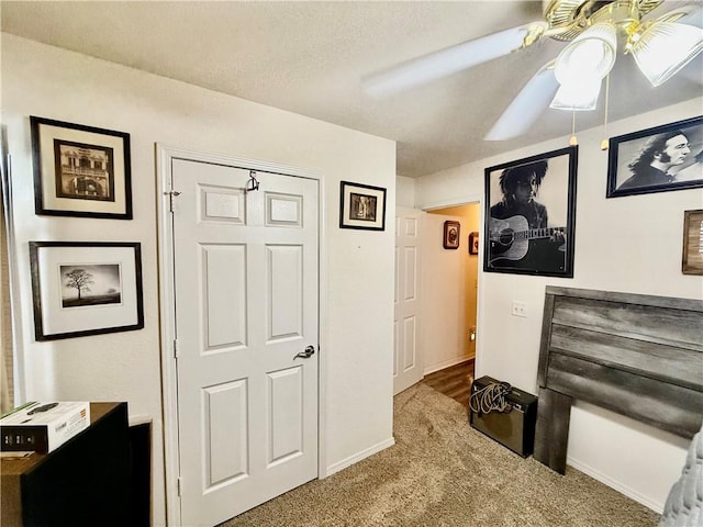interior space with carpet flooring and baseboards