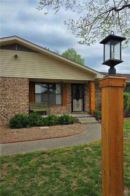 exterior space featuring brick siding