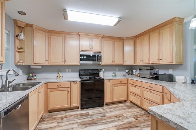 kitchen with stainless steel appliances, a sink, and light brown cabinetry
