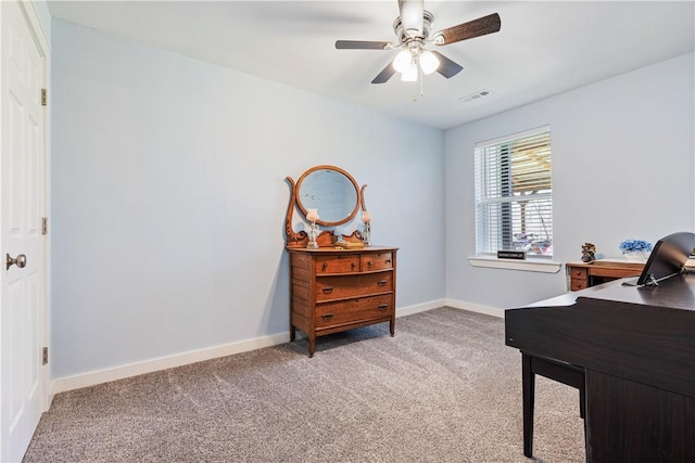 office space with light carpet, ceiling fan, baseboards, and visible vents