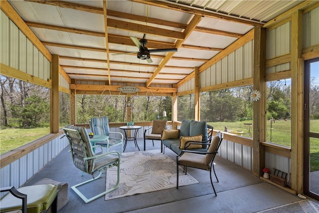 sunroom / solarium featuring ceiling fan and an outdoor hangout area