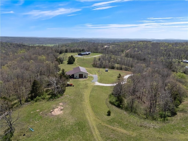 bird's eye view featuring a rural view and a forest view