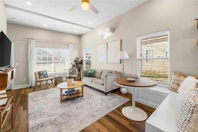 living room featuring ceiling fan, recessed lighting, a wall mounted AC, wood finished floors, and baseboards