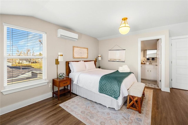 bedroom with a wall mounted AC, wood finished floors, and multiple windows