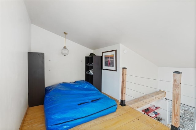 bedroom featuring vaulted ceiling