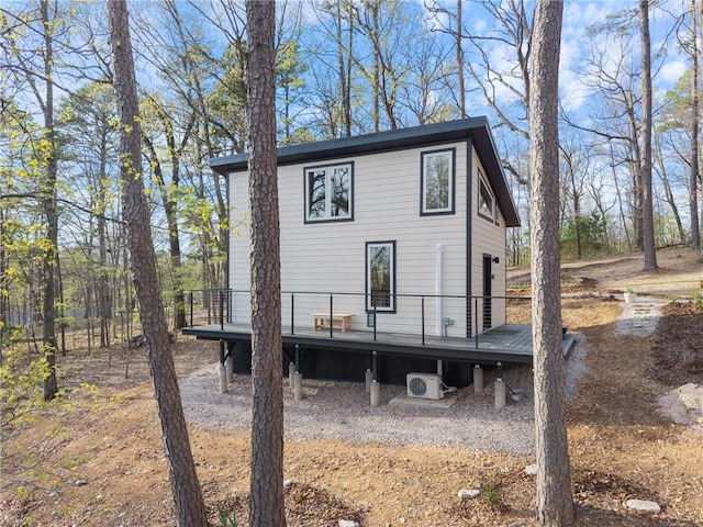 back of property featuring a deck