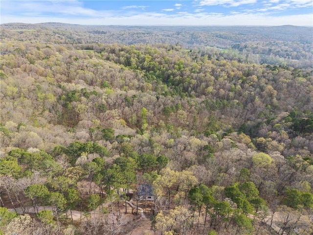 birds eye view of property with a wooded view