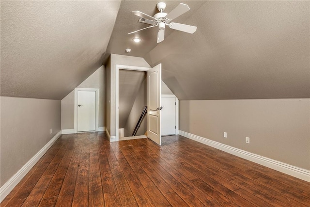 3512 Hamm Ln, Springdale, AR 72762 - bonus room with a ceiling fan, baseboards, dark wood finished floors, a textured ceiling, and vaulted ceiling