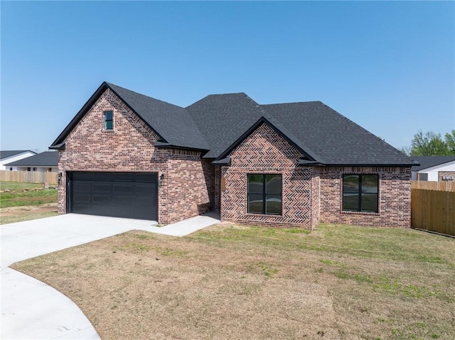 1900 Yellowstone Dr, Barling, AR 72923 - view of front of home featuring concrete driveway, a front yard, brick siding, and fence