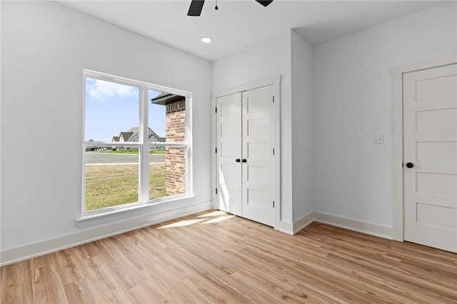 1900 Yellowstone Dr, Barling, AR 72923 - unfurnished bedroom with ceiling fan, a closet, light wood finished floors, and baseboards