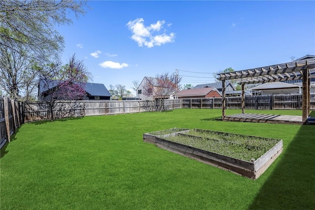 view of yard featuring a fenced backyard, a vegetable garden, and a pergola