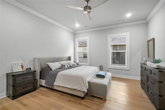bedroom with light wood-style floors, ornamental molding, baseboards, a ceiling fan, and recessed lighting