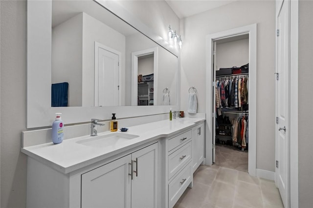 bathroom featuring vanity and a spacious closet