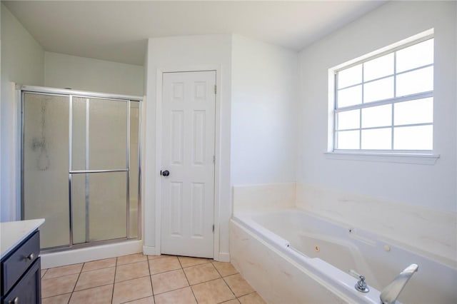 bathroom featuring a shower stall, vanity, tile patterned flooring, and a whirlpool tub