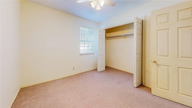 2416 Mulberry St, Rogers, AR 72758 - unfurnished bedroom featuring light carpet, a closet, ceiling fan, and baseboards