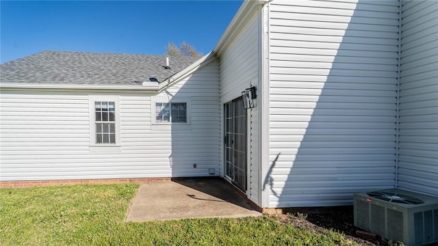 2416 Mulberry St, Rogers, AR 72758 - back of house featuring central AC unit, a yard, and roof with shingles