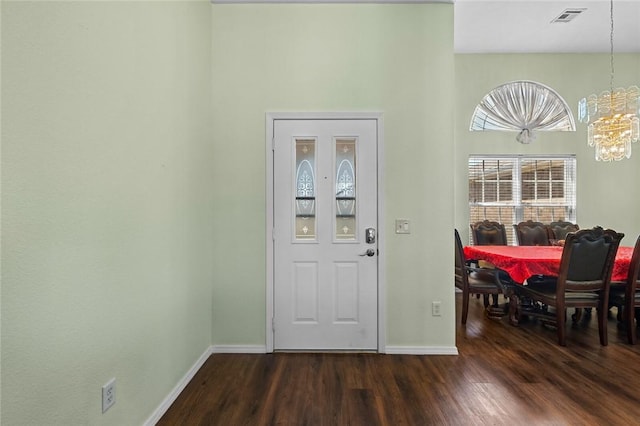 1901 SW Columbus Rd, Bentonville, AR 72713 - entryway with a chandelier, dark wood-style flooring, and baseboards