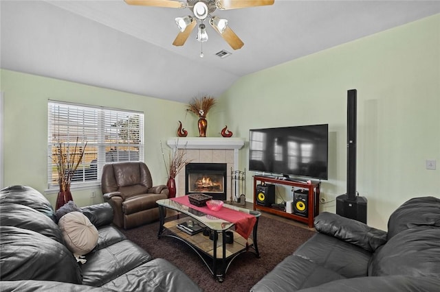 1901 SW Columbus Rd, Bentonville, AR 72713 - living area featuring lofted ceiling, a ceiling fan, and a tiled fireplace