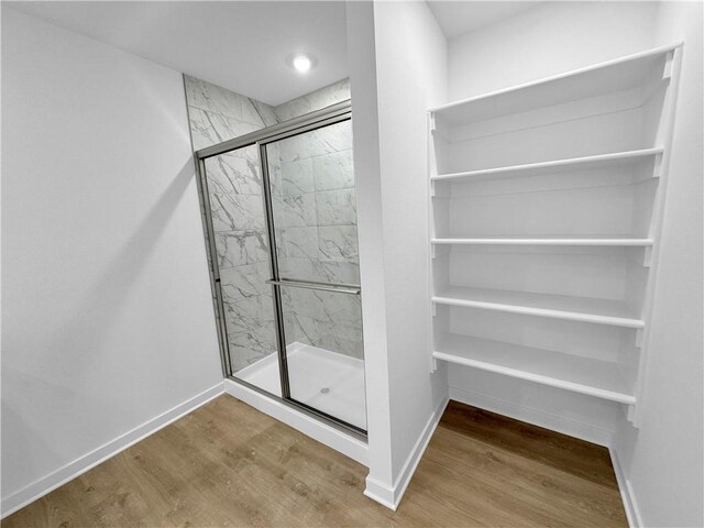 429 W Gosling Isle, Farmington, AR 72730 - full bath featuring a marble finish shower, baseboards, and wood finished floors
